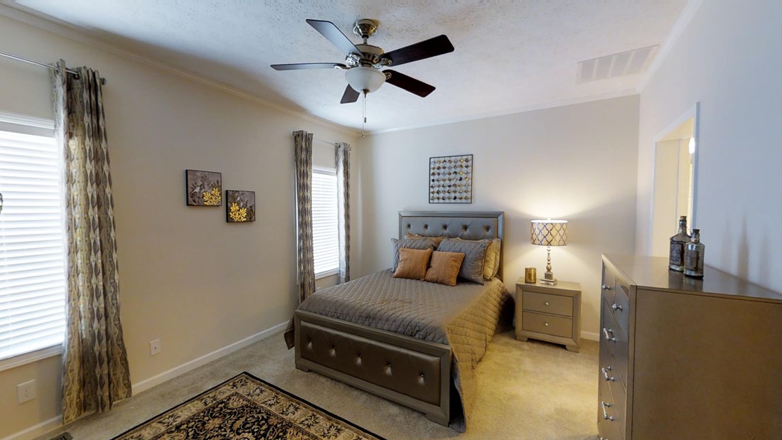 The 2917 HERITAGE Primary Bedroom. This Manufactured Mobile Home features 4 bedrooms and 2 baths.